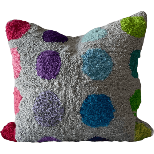 Gray pillow with colorful polka dots